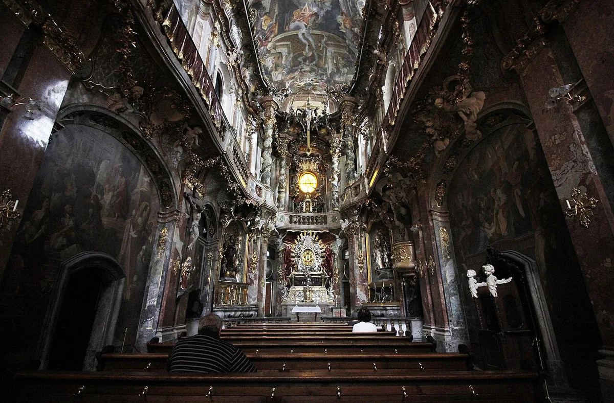 Ornate gilded Baroque interior of the Asamkirche in Munich — 2