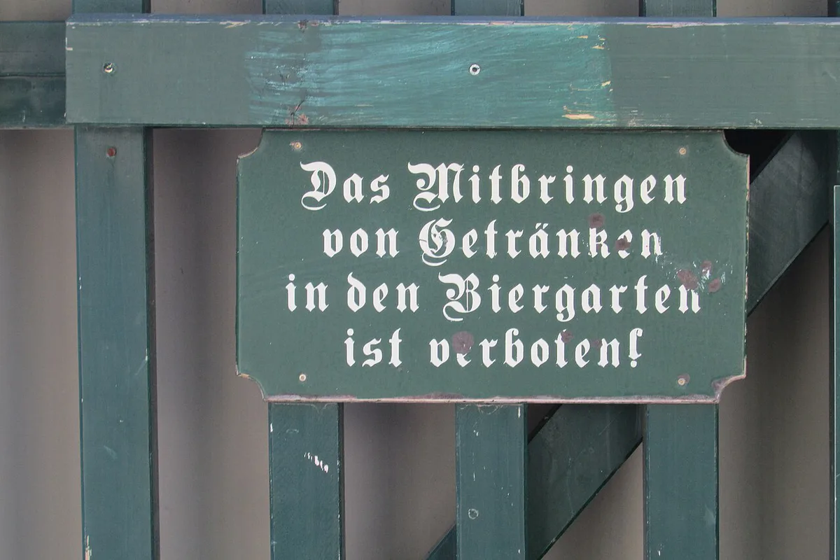 Long wooden tables under chestnut trees at a Munich beer garden — 2