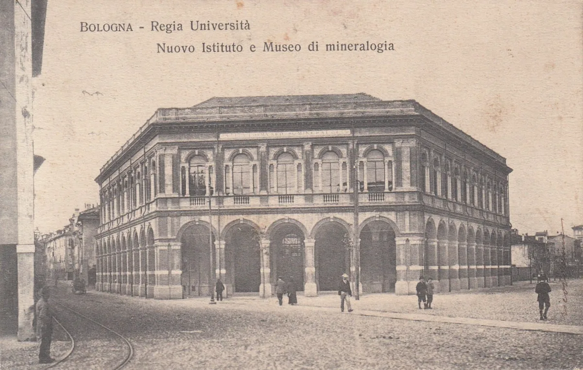 Aerial view of Bologna's terracotta rooftops and porticoed streets radiating from the historic center — 2