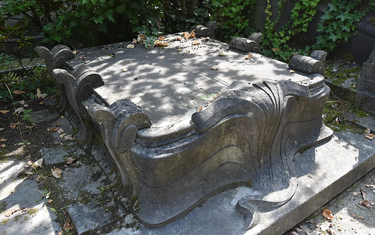 Ivy-covered Art Nouveau gravestones under trees at the Cimetière du Dieweg in Uccle, Brussels — 1