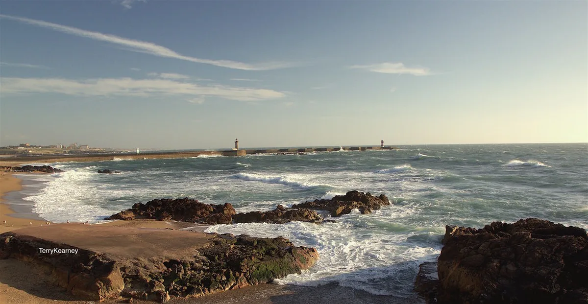 Praia das Pastoras at Foz do Douro with Atlantic waves and coastal promenade
