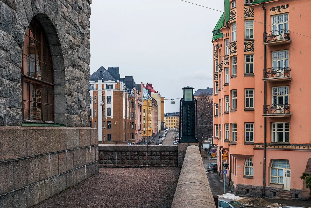 Colourful independent boutique storefronts along a Punavuori street in Helsinki's Design District — 1