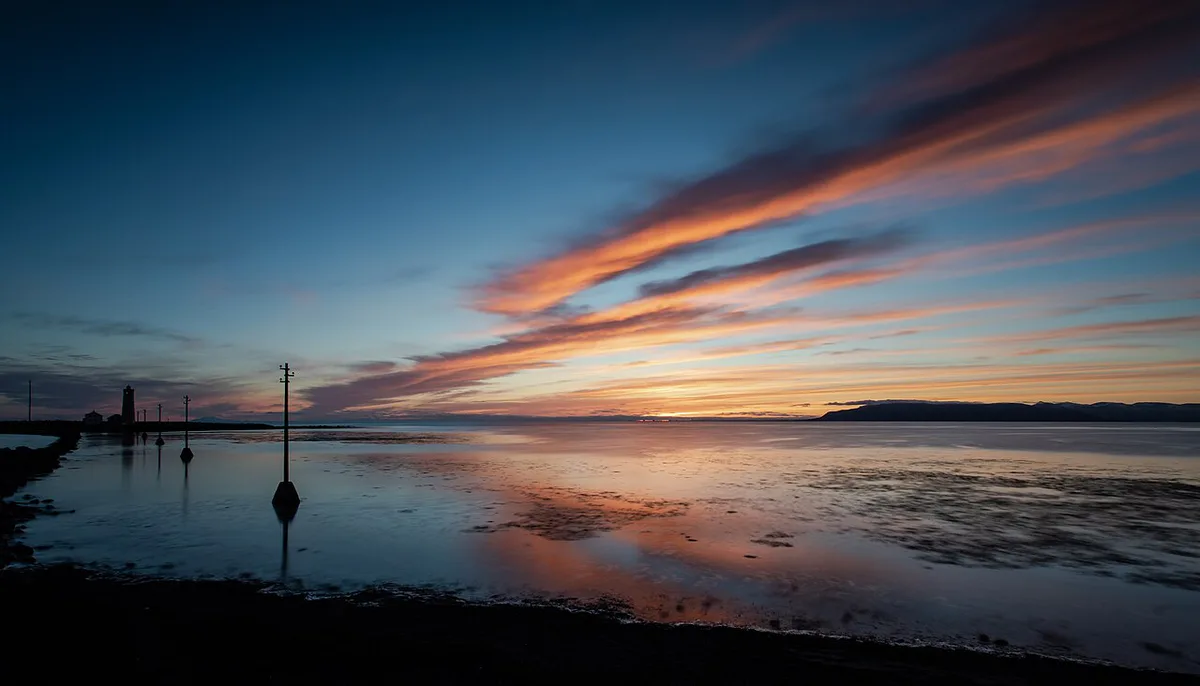 Grótta lighthouse on its windswept peninsula near Reykjavik at sunset — 1