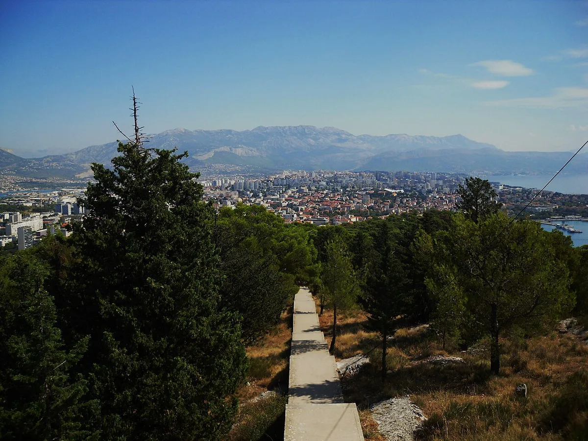 Narrow stone lane climbing through the old Veli Varoš quarter below Marjan hill in Split — 1