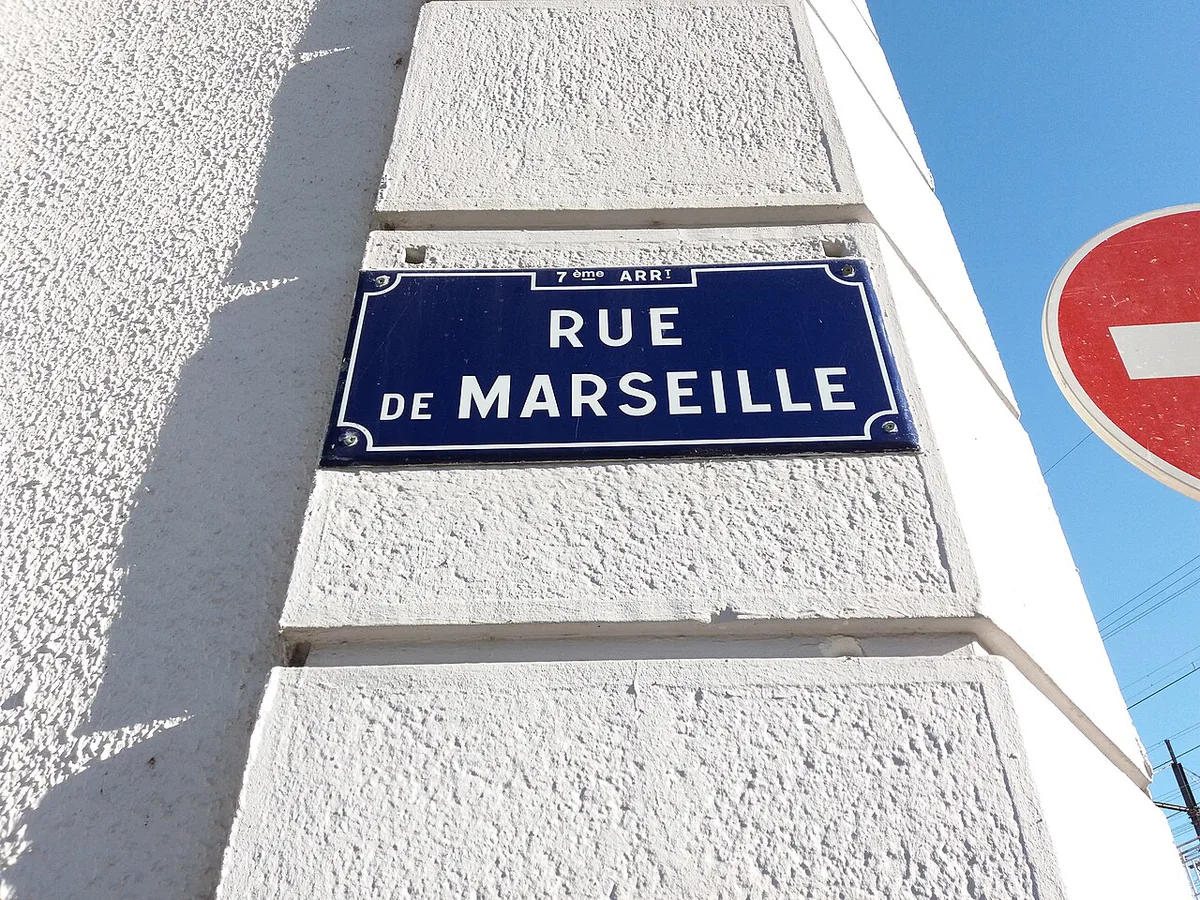 Shopfronts and market stalls along Rue de Marseille in Lyon's multicultural La Guillotière district — 1