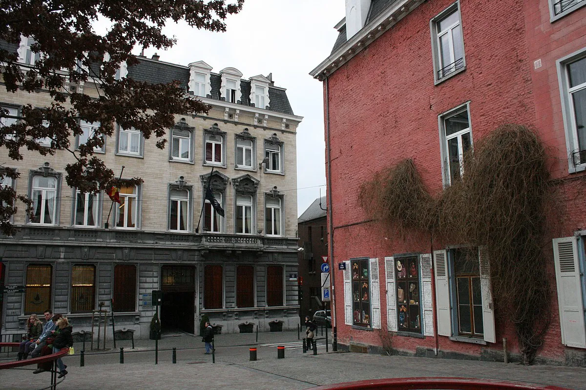 Quiet cobbled street lined with antique shops in the Marolles district of Brussels — 1