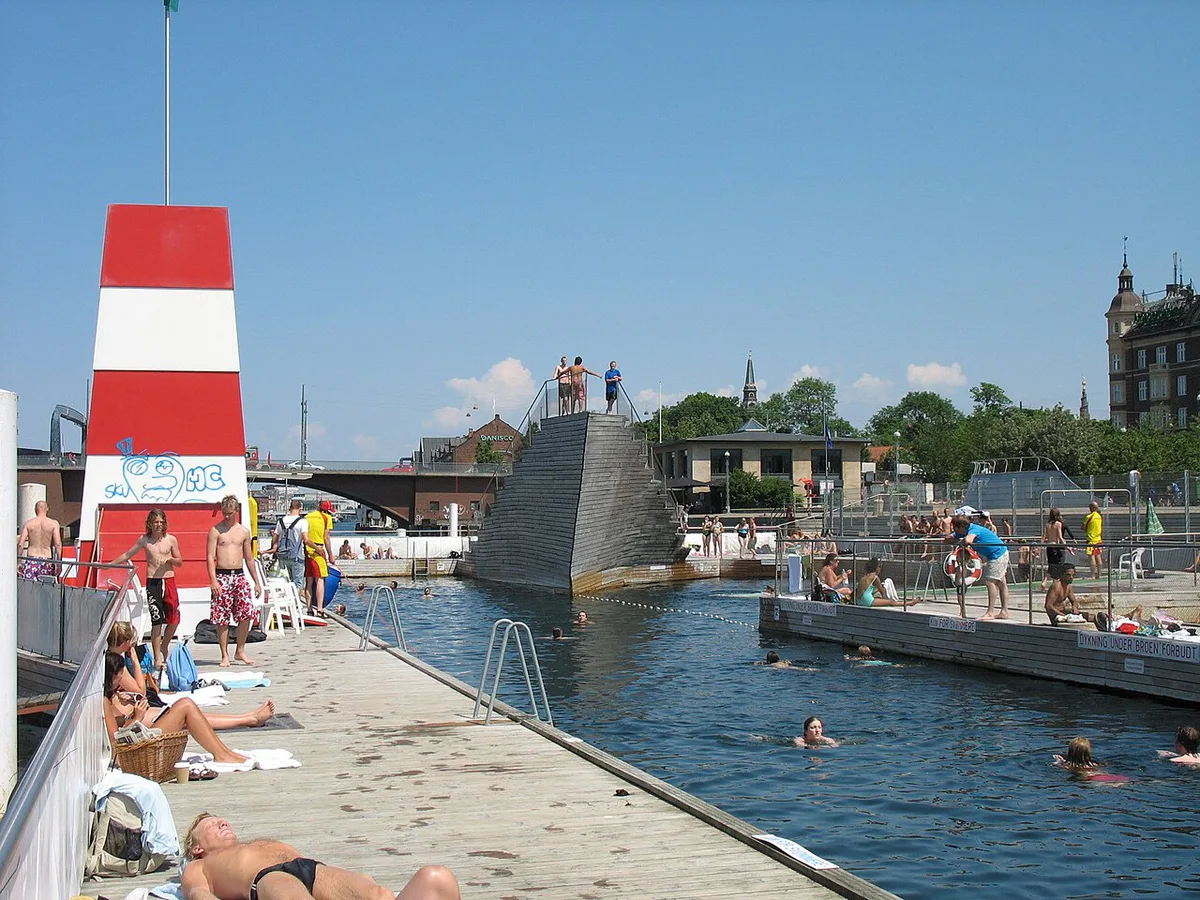 Cyclists riding along the Amager waterfront path near CopenHill in Copenhagen — 1