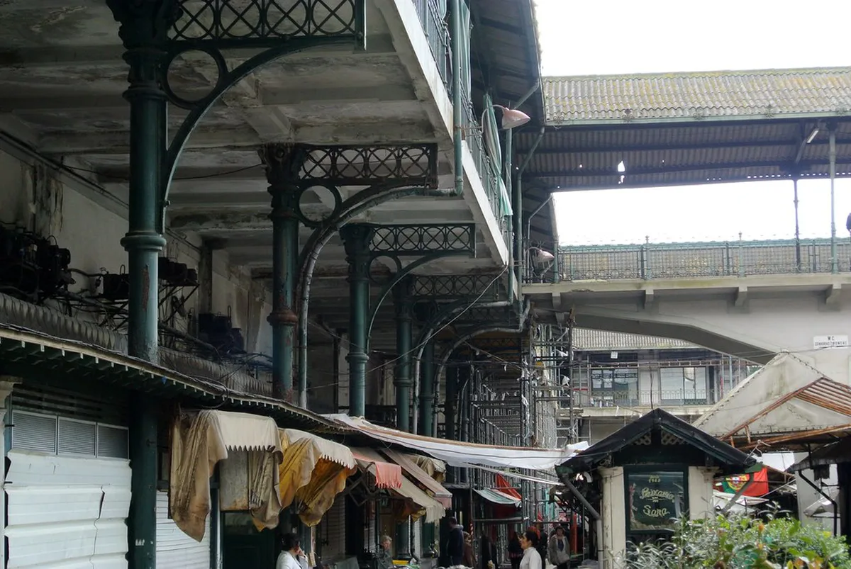 Bustling Bolhao market in Porto with local vendors and fresh produce, traditional Porto food market