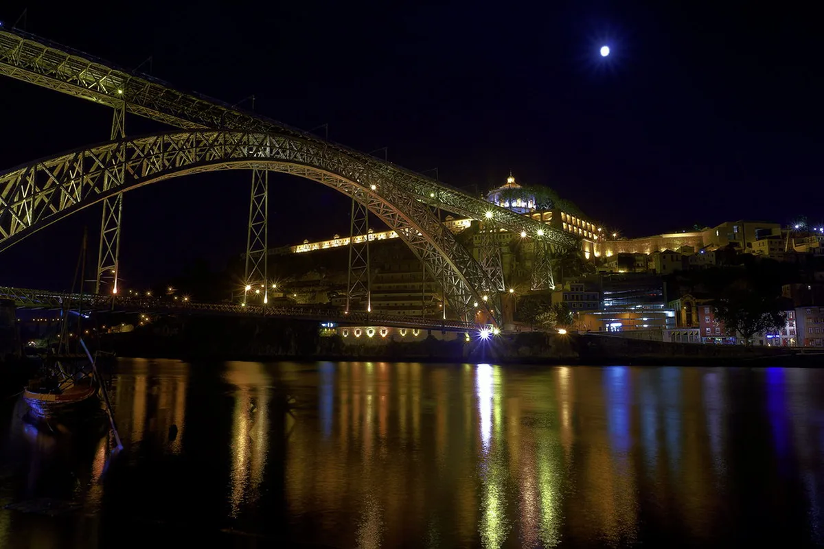 Impressive Dom Luís I Bridge with its iconic double-deck iron arch structure spanning the Douro River in Porto