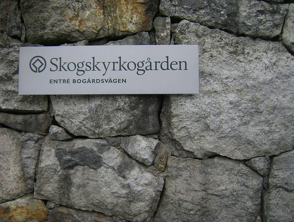 Pine trees and the granite cross on the lawn at Skogskyrkogården, Stockholm's UNESCO Woodland Cemetery — 2