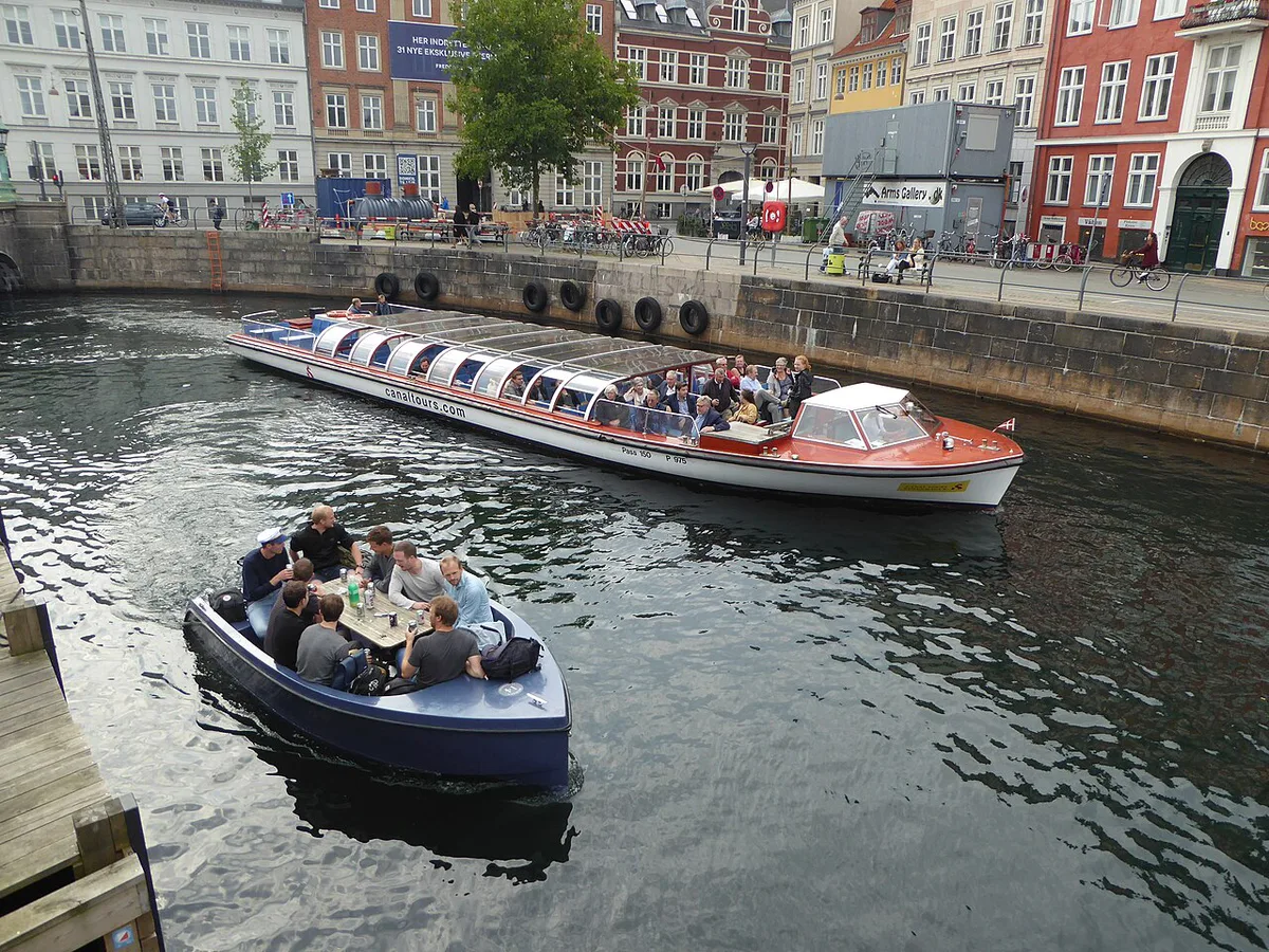 Skiers on the artificial rooftop ski slope of CopenHill above Copenhagen's harbor — 1