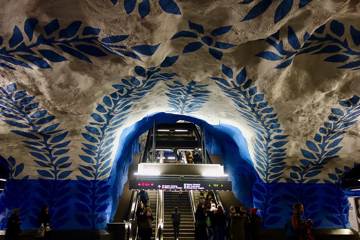 Blue painted cave-like platform of T-Centralen metro station, part of Stockholm's underground art network — 2